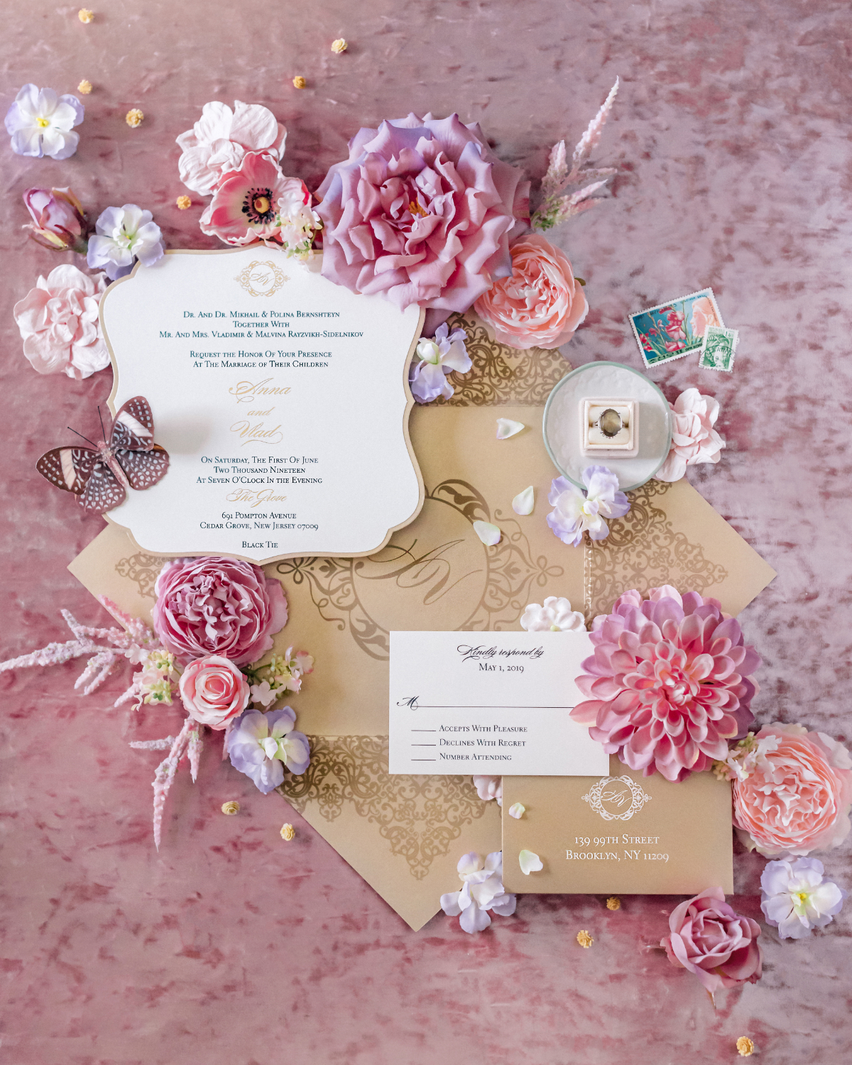 Soft pink and gold invitation suite styled with lush florals and layered stationery, a romantic custom wedding invitation design full of texture and warmth.